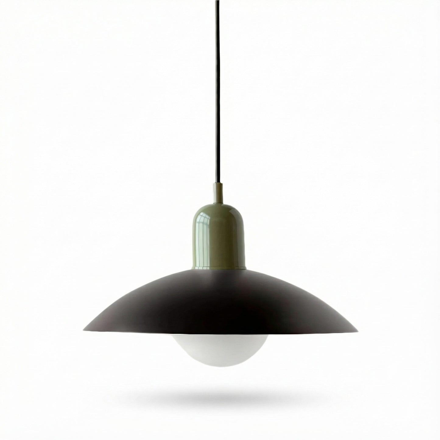 Pendant light with black shade and white bulb on a white background