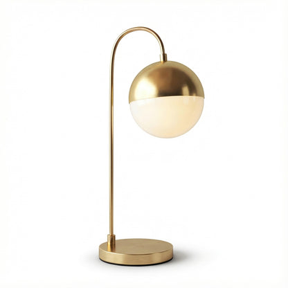 Gold table lamp with a spherical design on a white background