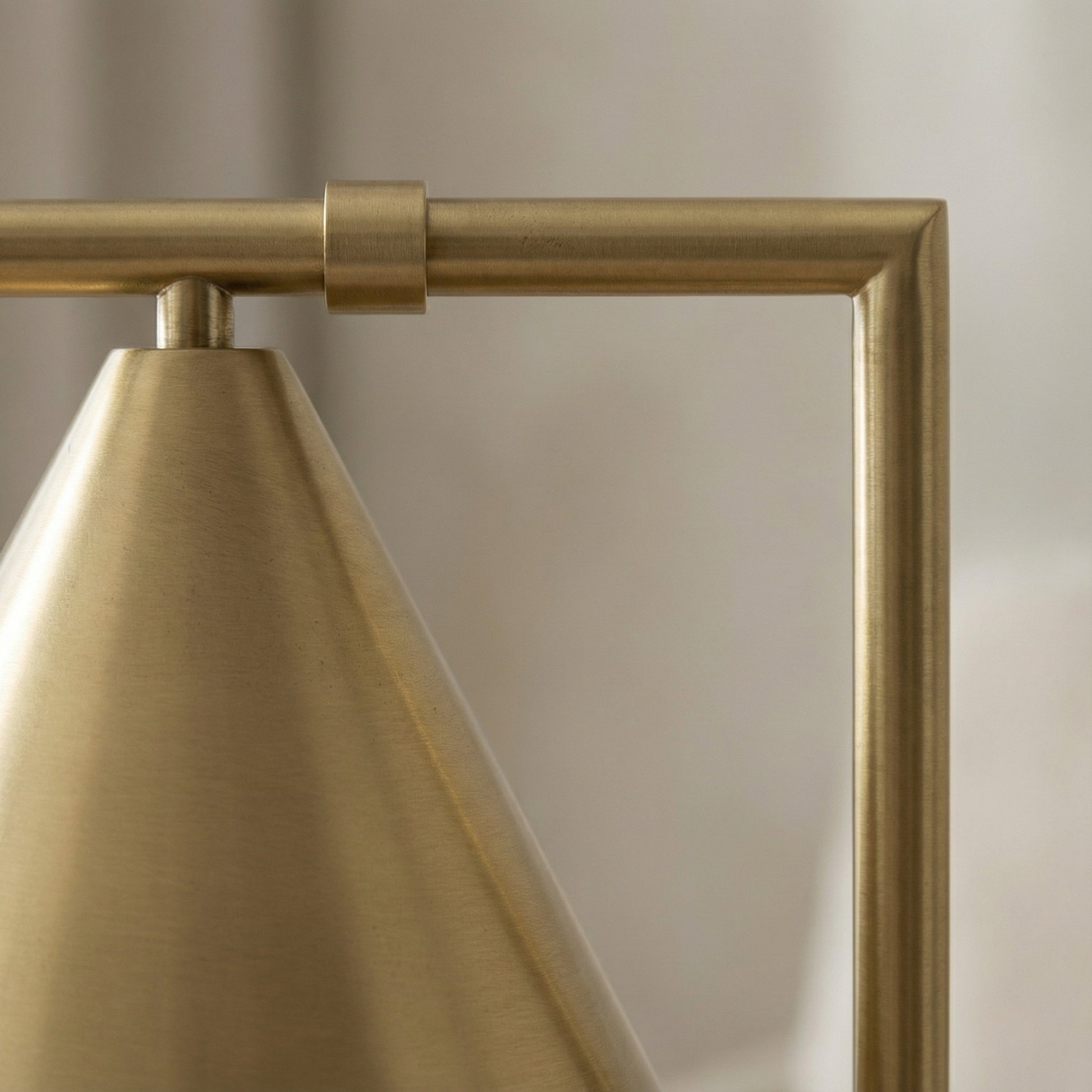 Close-up of a gold lamp with a soft background