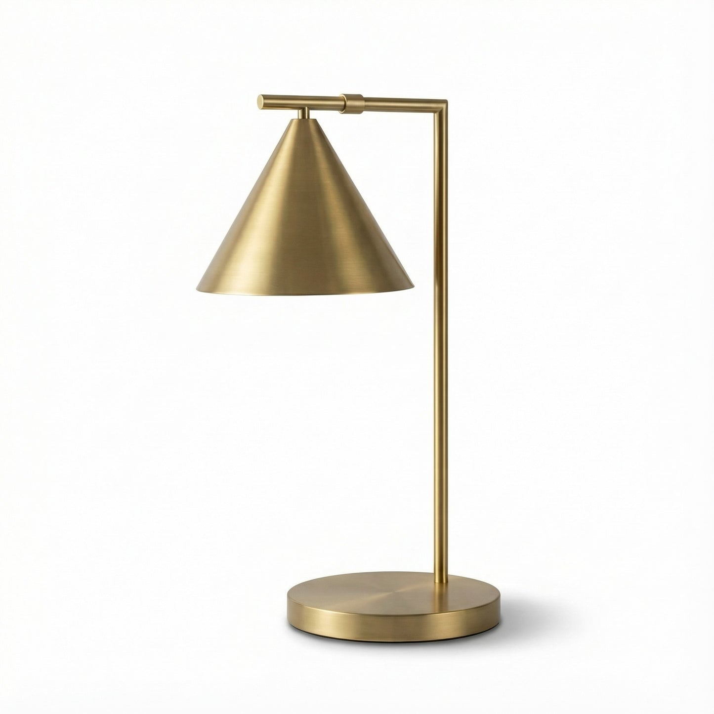 Gold table lamp with adjustable arm on a white background