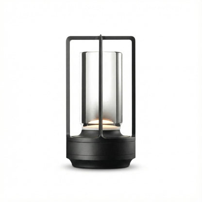 Black lantern-style lamp with glass cover on a white background