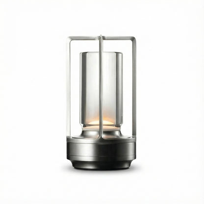 Modern outdoor lantern with glass shade and metal frame on a white background