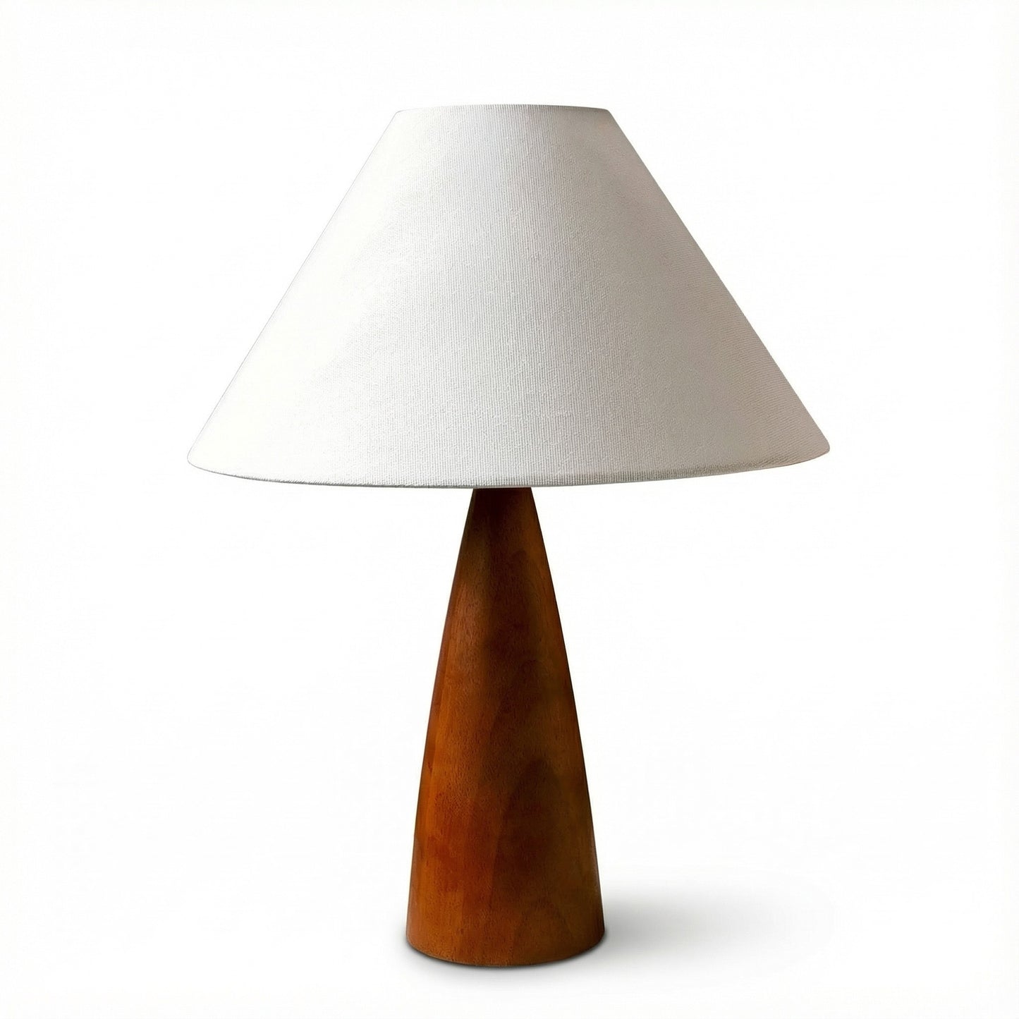 Table lamp with wooden base and white shade on a white background
