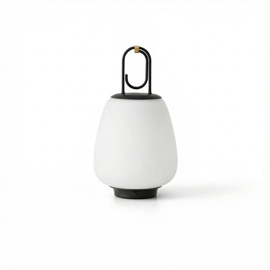 White outdoor lamp with black base and handle on a white background