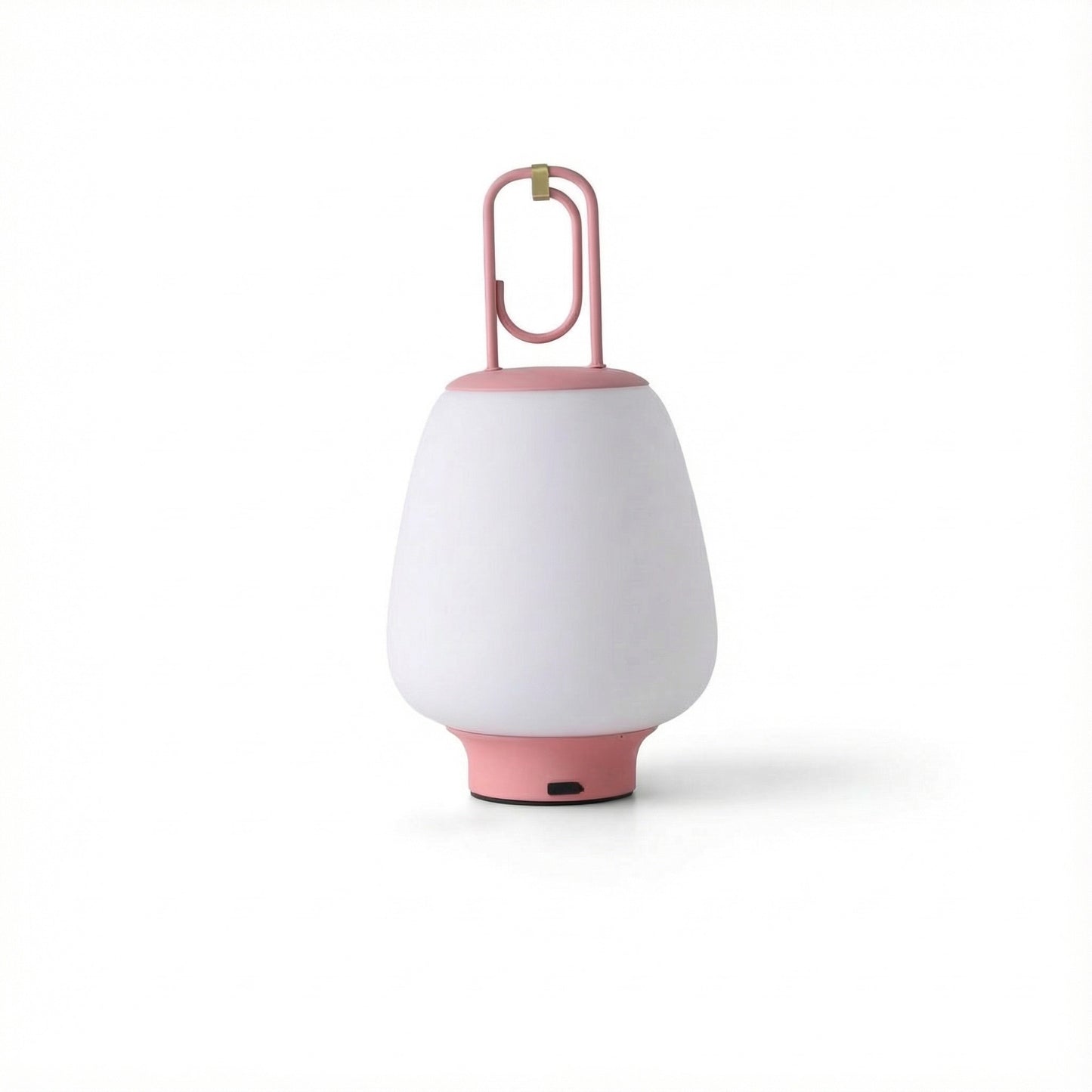 White portable lamp with pink base and handle on a white background