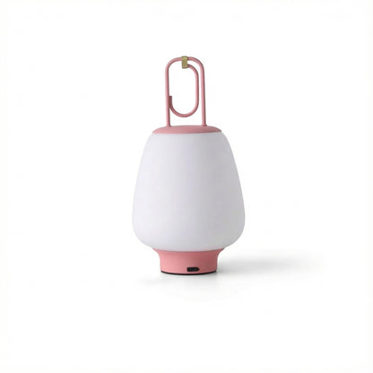 White portable lamp with pink base and handle on a white background