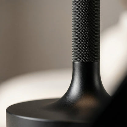 Close-up of a black textured object on a blurred background