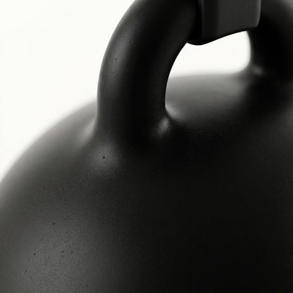 Close-up of a black pendant lamp on a white background