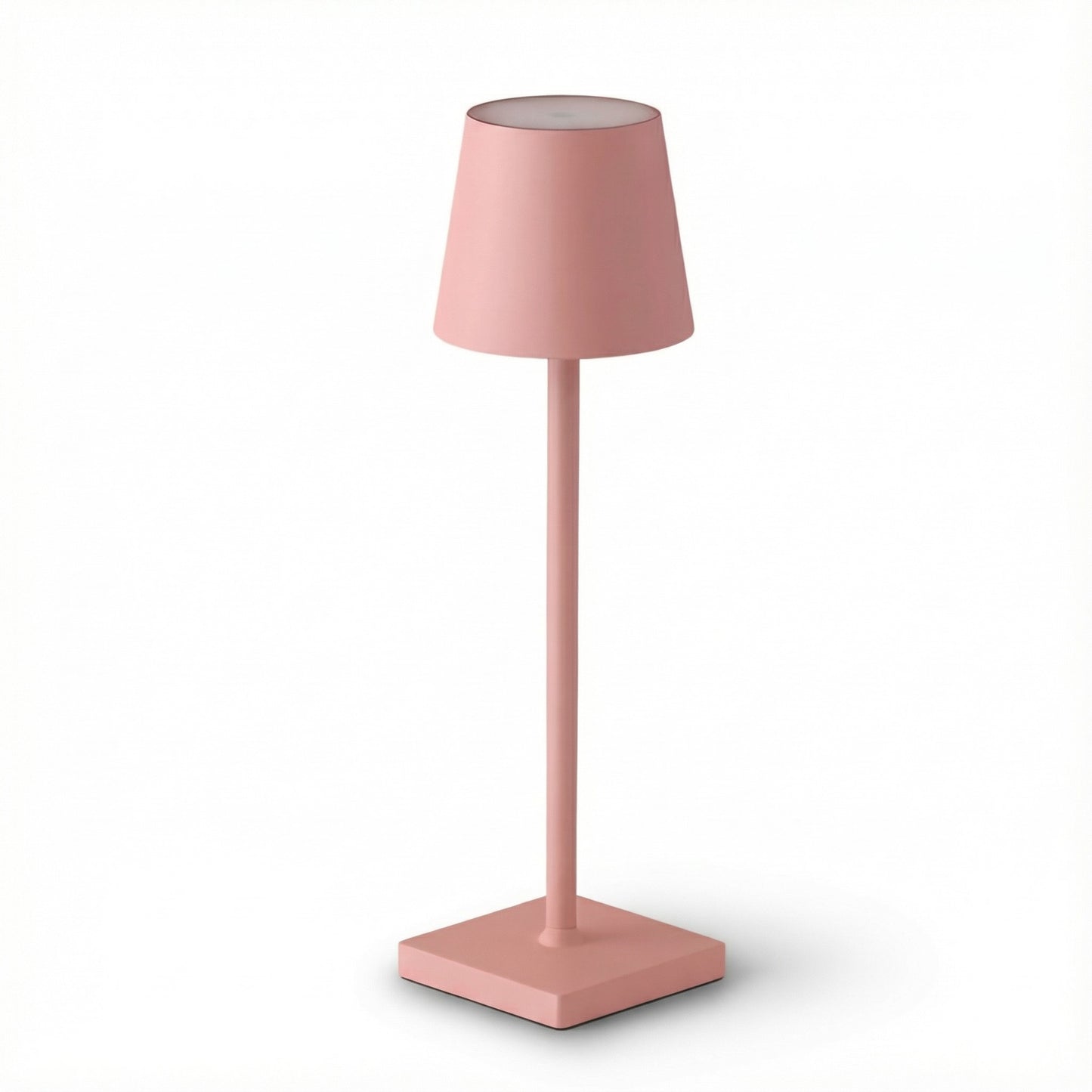 Pink table lamp with a square base on a white background