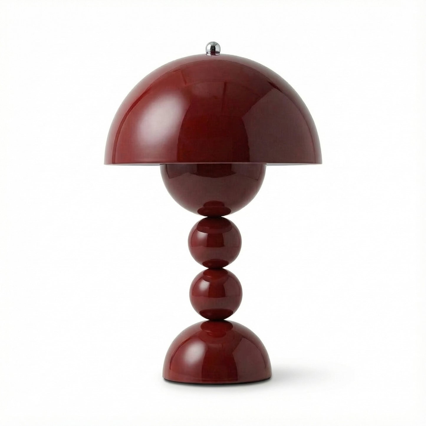 Red table lamp with a unique design on a white background