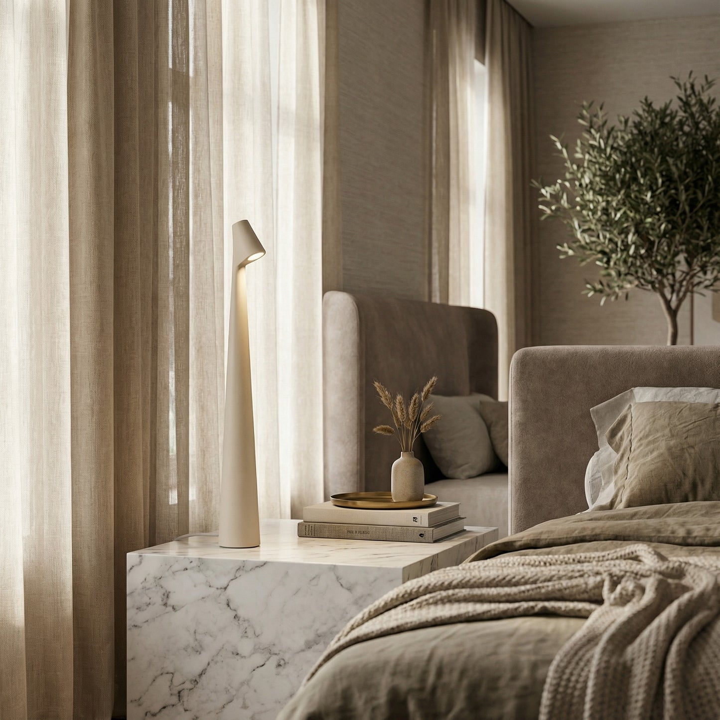 Modern bedroom with a bed, lamp, and decorative elements.