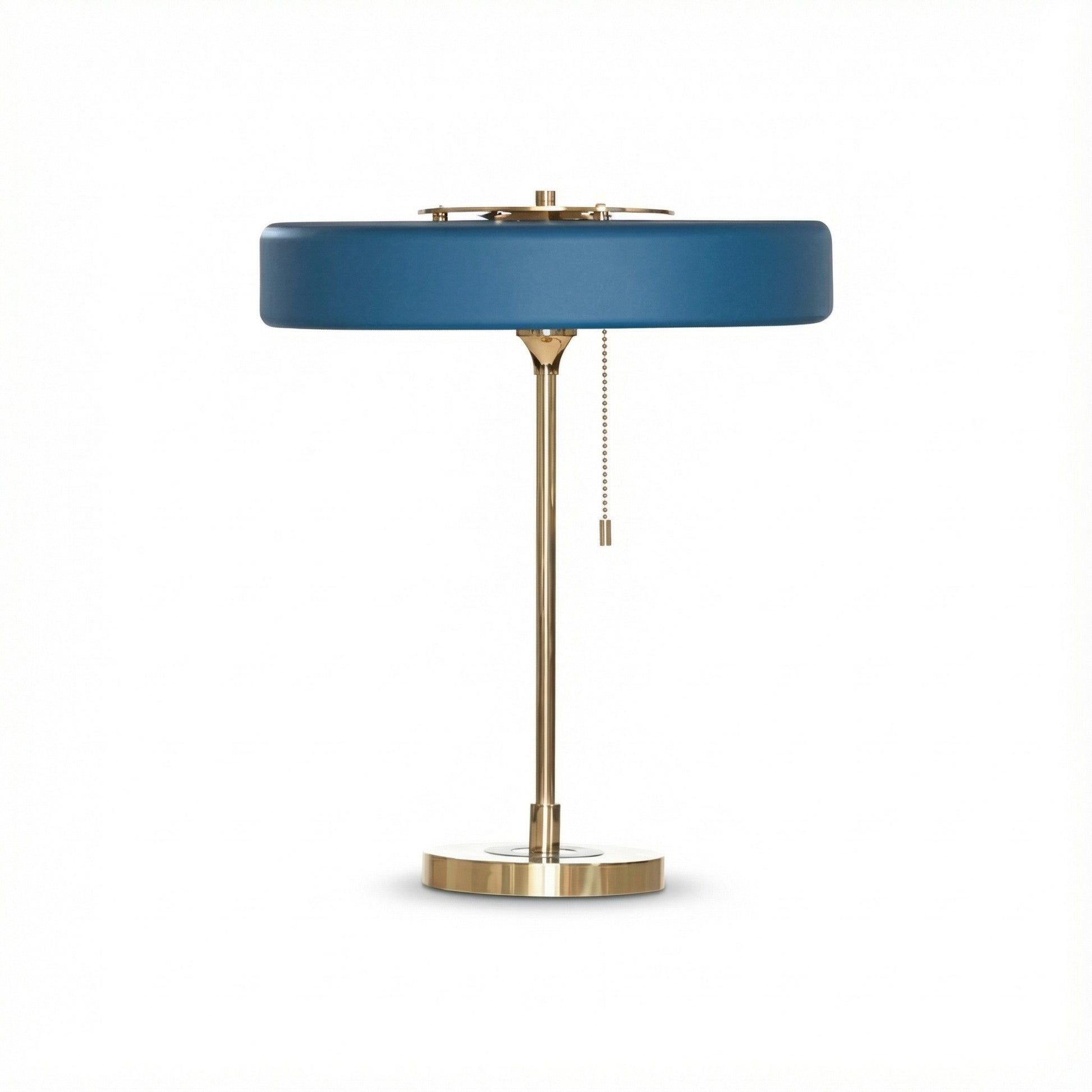 Table lamp with blue shade and brass base on a white background