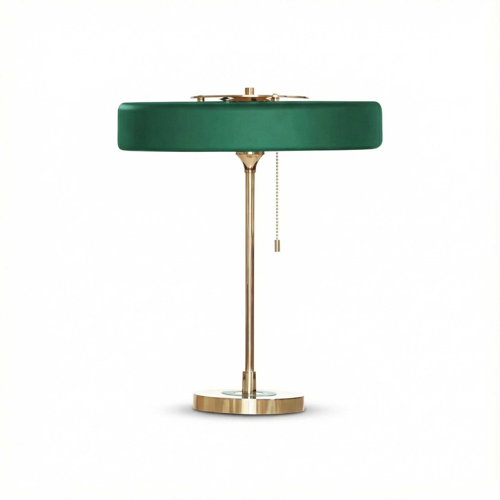 Green lamp with brass base on a white background