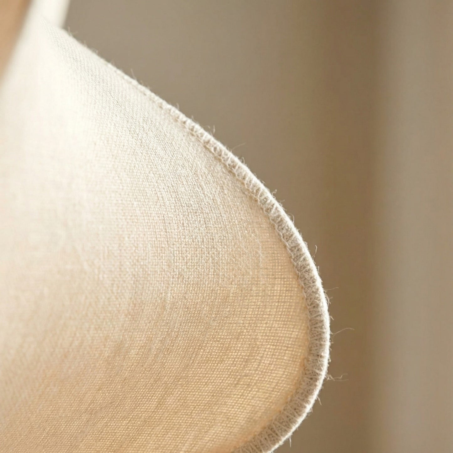 Close-up of a beige fabric texture with a blurred background