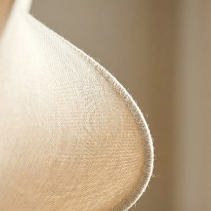Close-up of a beige fabric texture with a blurred background